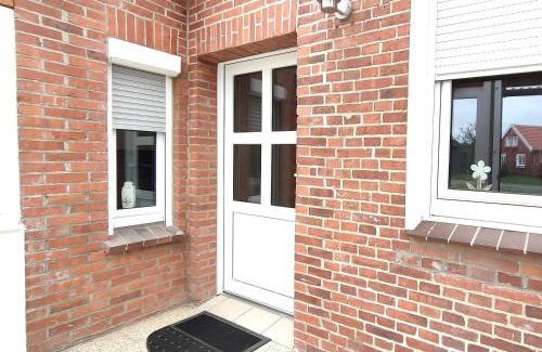 Weener Apartment | Gemütliches Ferienhaus Lütje Huske mit Garten, 25666