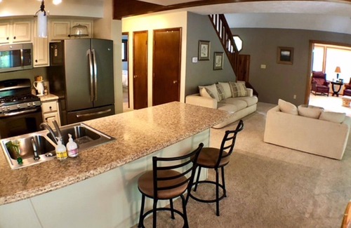 Higgins Lake House | Get away to this beautiful open concept house within walking distance to Higgins