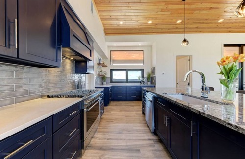 Concan House | Glam Luxury Home by Frio River! Heated Infinity Pool Firepit Huge Hot Tub Views