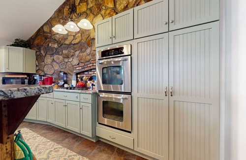Center Ossipee House | Glistening lakefront home with fireplace, kitchen, dock, canoe, grill, & patio
