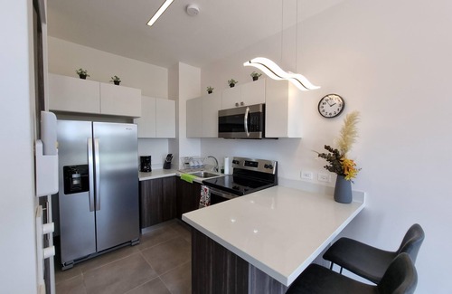 Alajuela Apartment | Golden Loft with AC, Pool, 5 min from the Airport!