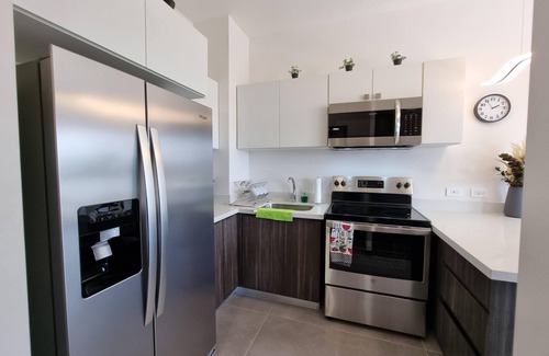 Alajuela Apartment | Golden Loft with AC, Pool, 5 min from the Airport!