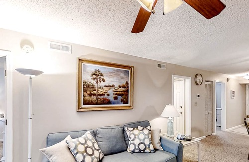 Colonial Charters Condo | Golf course community condo with fairway views, on-site pool, & balcony