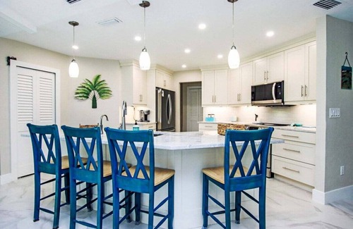 Beachview Country Club Estates House | Golf course pool home on 12th hole of the Sanibel Island Golf Club - Isle Awhile