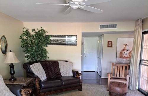 Sun City West House | Golf course view home with a private backyard oasis