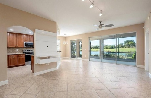 Naples House | Golf/Lake View 2 Bed+Den Coach Home In Amenity Rich Community, the Quarry!