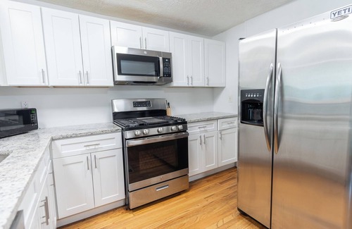 Stone Mountain House | Gorgeous 4-Bed Home Sleeps 20, Near Airport & Downtown!