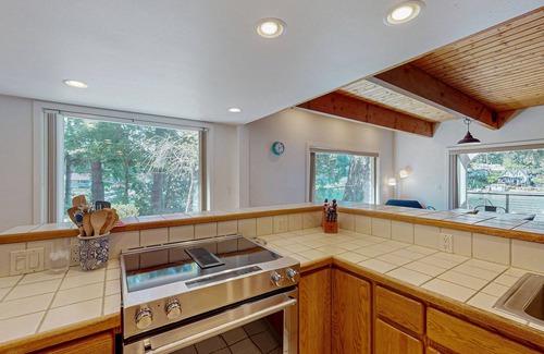 West Hills House | Gorgeous bay front gem with decks, grill, fireplace, wood stove, & private sauna