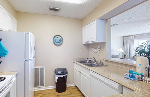Fort Bay Condo | Gorgeous beachfront condo with shared pool, hot tub and beach access