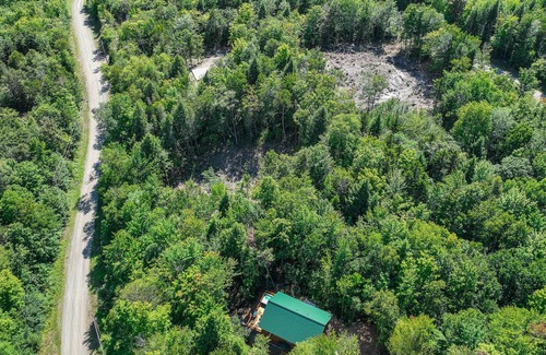 Carrabassett Valley Cabin | Gorgeous dog-friendly home with deck, hot tub, gas fireplace, & spectacular view