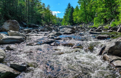 Carrabassett Valley Cabin | Gorgeous dog-friendly cabin with great view, deck, hot tub, & gas fireplace