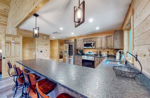 Carrabassett Valley Cabin | Gorgeous dog-friendly cabin with great view, deck, hot tub, & gas fireplace