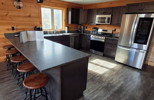 Carrabassett Valley Cabin | Gorgeous dog-friendly cabin with great view, deck, hot tub, & gas fireplace