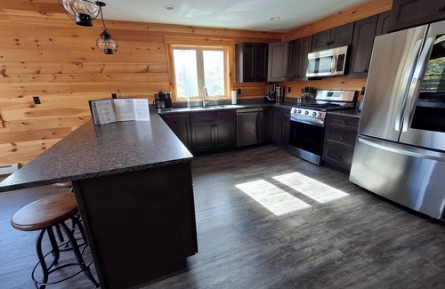 Carrabassett Valley Cabin | Gorgeous dog-friendly cabin with great view, deck, hot tub, & gas fireplace