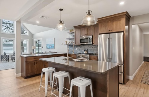 Naples Ski Chalet | Gorgeous luxury home with large sandy beach and sunset views on Brandy Pond!