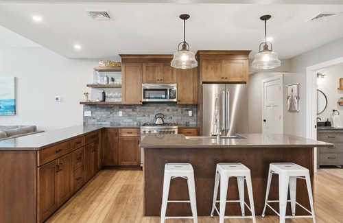 Naples Ski Chalet | Gorgeous luxury home with large sandy beach and sunset views on Brandy Pond!