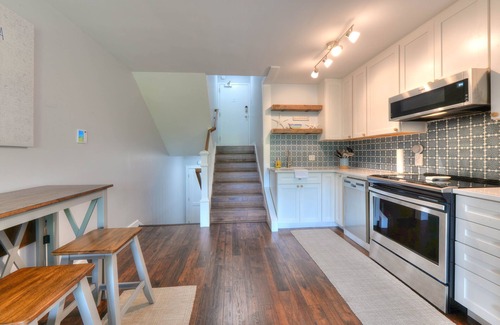 The Pines Condo | Gorgeous renovated property in town & walking distance to the beach & shops