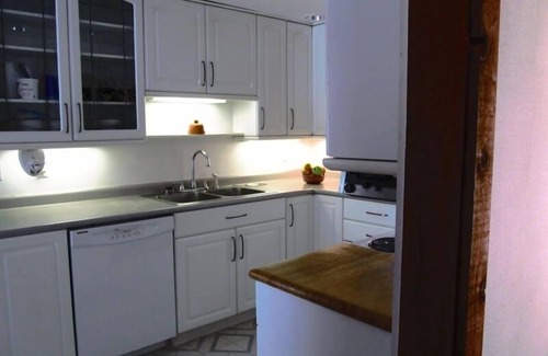 Suttons Bay House | Gorgeous Water Front Home - Sand, Sunsets & Fun!