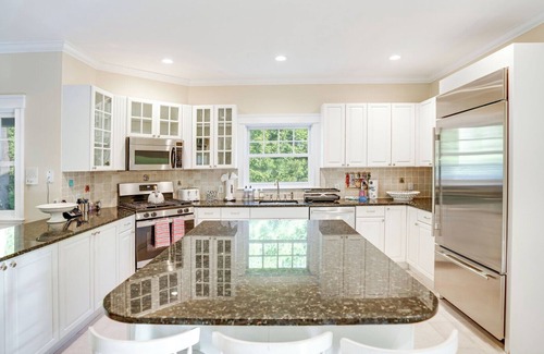Wainscott Woods House | Gourmet Eat-In Kitchen, Master Suite, Fieldstone Patios