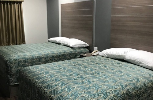 Humble Hotel | Grand Villa Inn & Suites - Humble