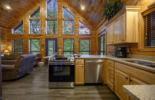 Broken Bow Cabin | Grandview ~ Riverfront with play set, hot tub, kayaks and outdoor patio