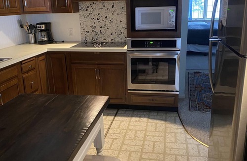 Empire House | Great Glen Arbor location! Private wooded setting, quick walk to town! Sleeps 9