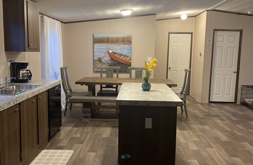 Many House | Great location. covered patio/5 minutes away from restaurants stores boat launch
