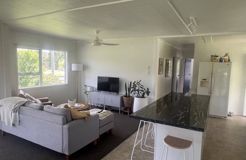Tolaga Bay House | Great river views from this cute modernised and homely cottage!
