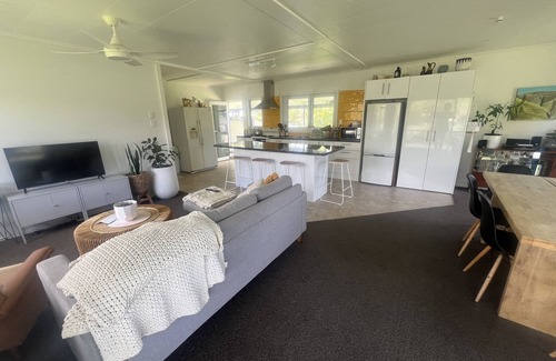 Tolaga Bay House | Great river views from this cute modernised and homely cottage!