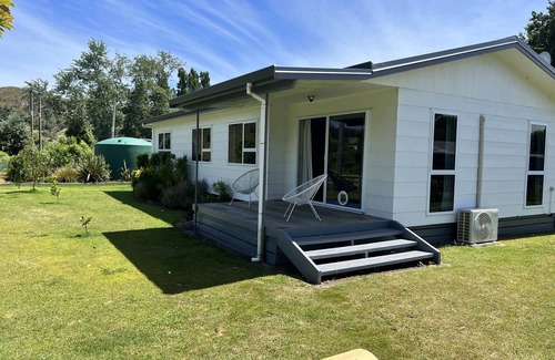 Tolaga Bay House | Great river views from this cute modernised and homely cottage!