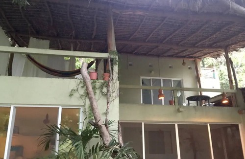Arroyo Cruz House | Great room with deck pool in front of perfect bay