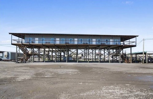 Delacroix Cabin | Great view of bayou-fishing lodge- sleeps 6. Fish cleaning station & bbq pits.