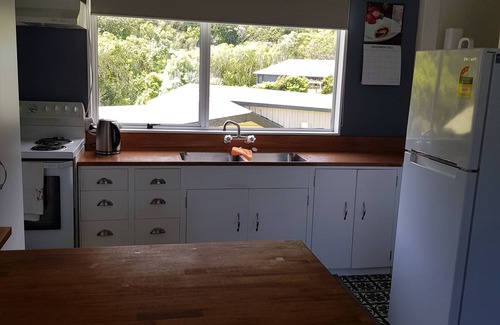 Okiwi Bay House | Great views from this double storey bach. Very close to sandy beach.