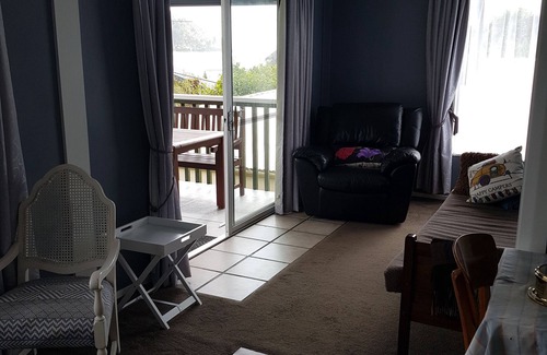 Okiwi Bay House | Great views from this double storey bach. Very close to sandy beach.