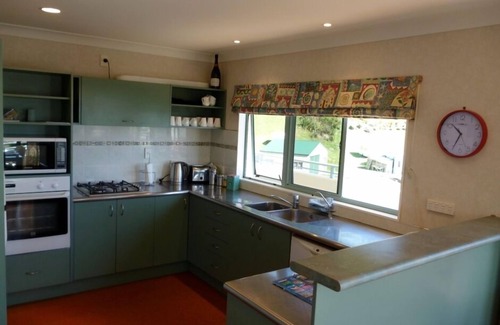 Opito Bay House | Great views, great family bach, super close to the beach and a spa pool!