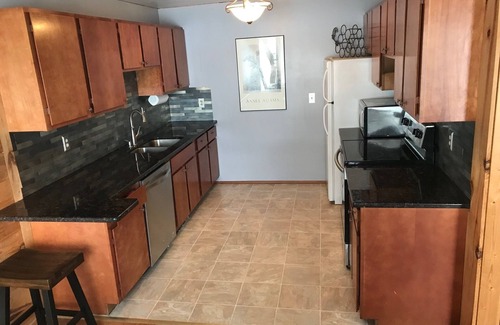 Interlochen Cottage | Green Lake: Charming Cottage with Sandy Beach & Dock - Ideal for Family Getaways