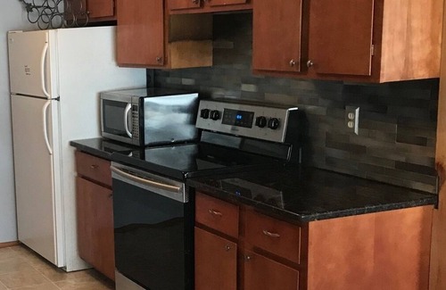 Interlochen Cottage | Green Lake: Charming Cottage with Sandy Beach & Dock - Ideal for Family Getaways