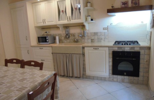 Chianni House | Ground floor apartment with loggia and garden, panoramic view
