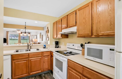 Butler Beach Condo | Ground-floor condo next to the tennis courts with 2 pools, sauna, beach access