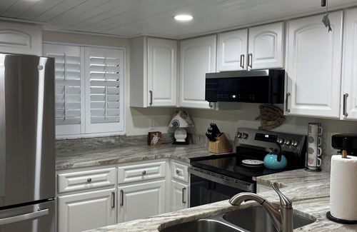 New Smyrna Beach Condo | Ground floor newly remodeled large condo on car free section-New Smyrna Beach