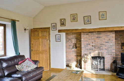 Burythorpe Cottage | Ground Floor: nLiving room: TV, Open FirenDining room.