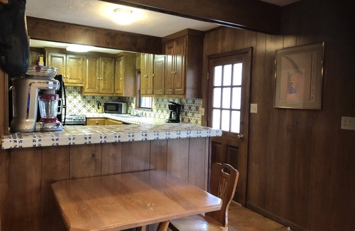 New Braunfels Cabin | Guadalupe River Road Retreat Southwestern Cabin