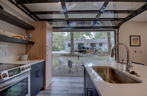 Charlotte House | Guest house · Ultra Modern open w/retractable glass garage door