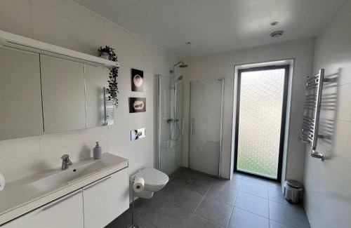 Osteraker House | Guest room with private bathroom