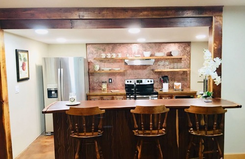 Missoula House | Guest suite attached to log home in the FOREST