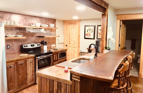 Missoula House | Guest suite attached to log home in the FOREST