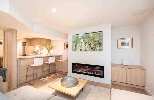 Winnipeg House | Guest suite in The Gates - Lower level luxury with sauna, workspace & fireplace