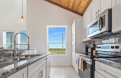 Pointe San Luis House | Gulf view beauty with vaulted ceilings, quick beach access, & community pool