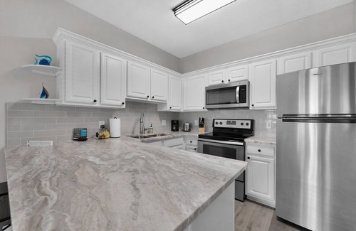 Crystal Shores Condo | Gulf Views * Steps to the Beach * Private Patio