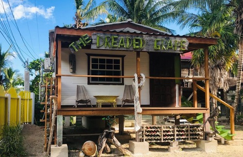 Caye Caulker House | Gumbo Limbo's Dreaded Grape Cabana - Steps from Ocean, Free Bikes, Free WiFi